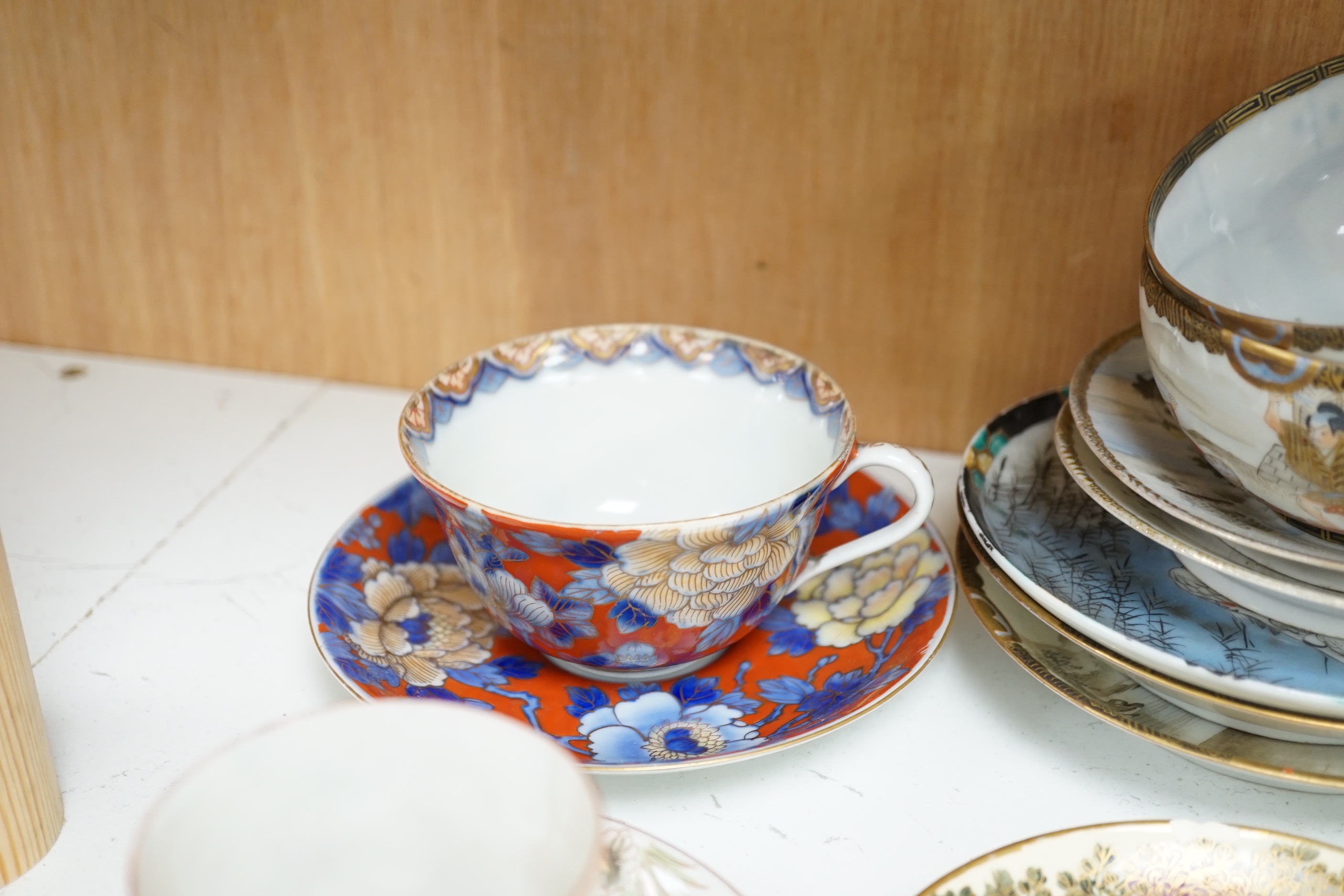 A group of Japanese ceramics, Meiji period and later including satsuma saucers and Imari cup and saucer, largest 17cm in diameter